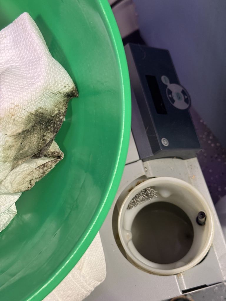 grimy towels next to the cleaned reservoir