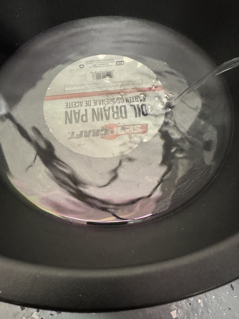 a sheen of oil floating on top of the coolant