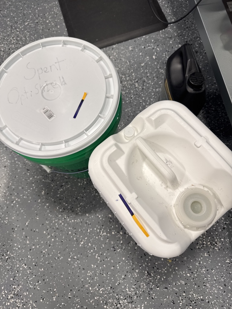 Two tubs, spent OptiShield and fresh, both with the same PH